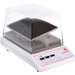 OHAUS ISRK04HDG incubating rocking shaker with a clear enclosure, black rocking tray, and front-mounted digital controls.